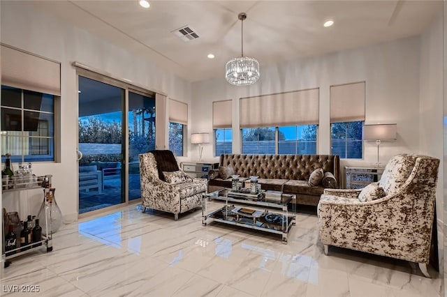 living room featuring recessed lighting, marble finish floor, visible vents, and a notable chandelier