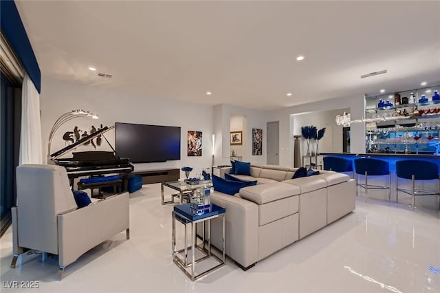 living room with recessed lighting and visible vents