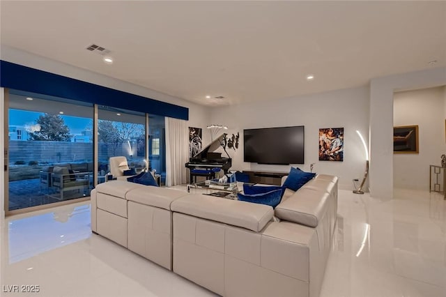 living room featuring light tile patterned floors, recessed lighting, and visible vents