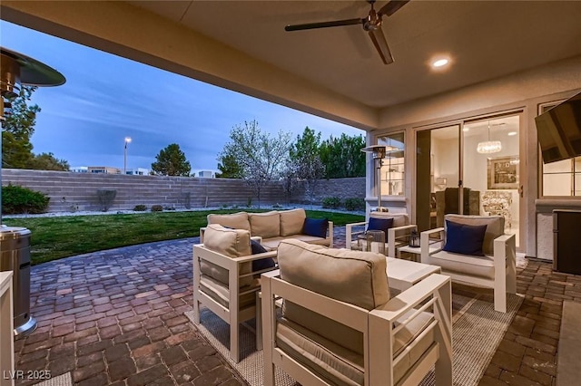 view of patio featuring a fenced backyard and an outdoor living space