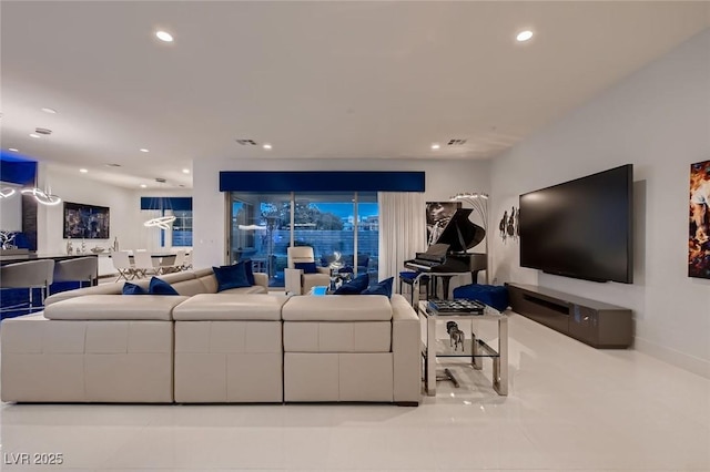 living room featuring visible vents and recessed lighting