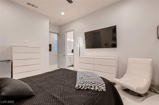 bedroom with marble finish floor, ensuite bath, visible vents, and recessed lighting