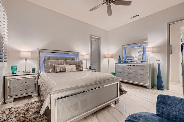 bedroom featuring marble finish floor, ceiling fan, and visible vents