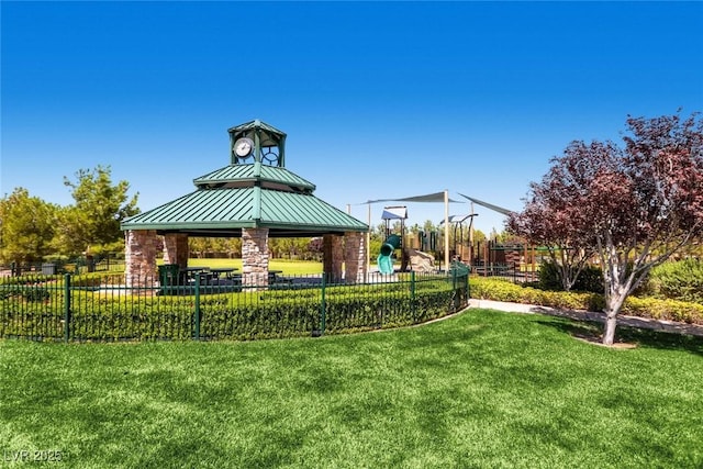 surrounding community with a yard, playground community, a gazebo, and fence