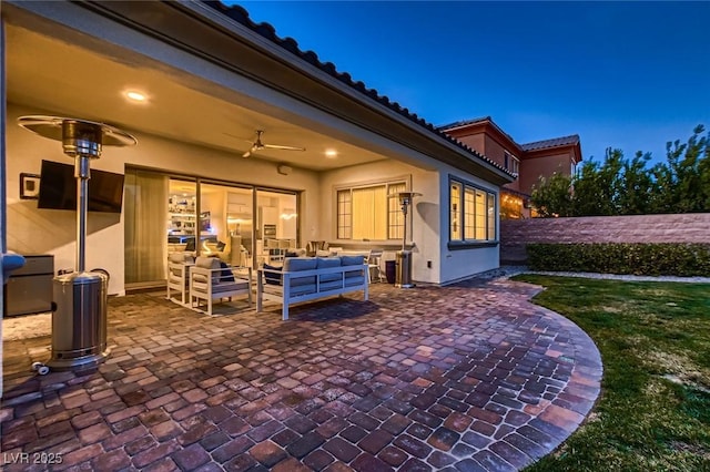 view of patio / terrace with ceiling fan and outdoor lounge area