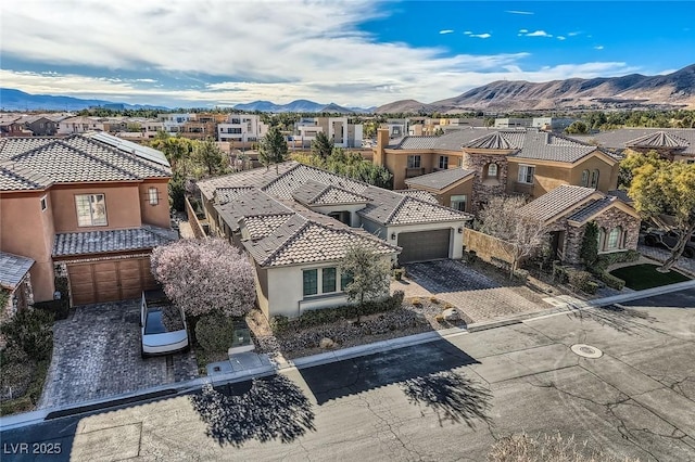 drone / aerial view with a residential view and a mountain view