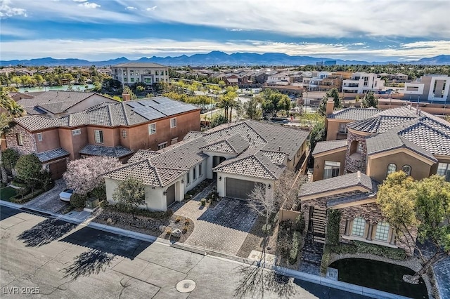 drone / aerial view with a residential view and a mountain view