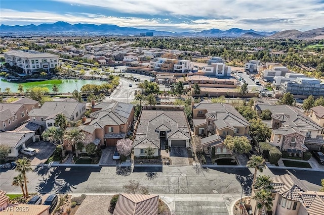 bird's eye view featuring a water and mountain view and a residential view