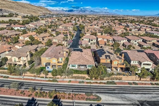 birds eye view of property with a residential view and a mountain view