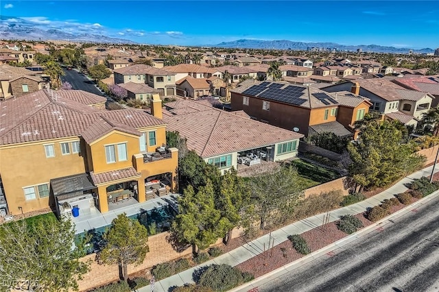 drone / aerial view featuring a mountain view and a residential view