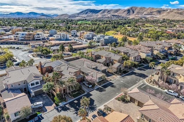 drone / aerial view featuring a residential view and a mountain view