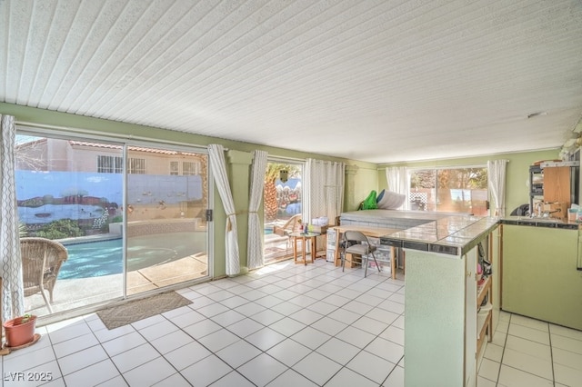 kitchen featuring tile counters and light tile patterned floors