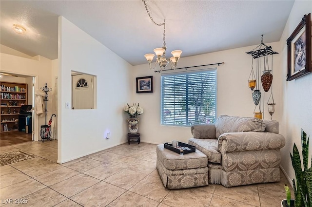 living area with vaulted ceiling, a notable chandelier, and light tile patterned flooring