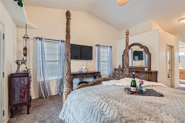 carpeted bedroom featuring vaulted ceiling, baseboards, and ensuite bathroom