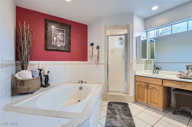 full bathroom featuring a garden tub, recessed lighting, vanity, a shower stall, and tile patterned flooring