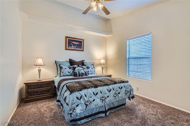 carpeted bedroom featuring ceiling fan and baseboards