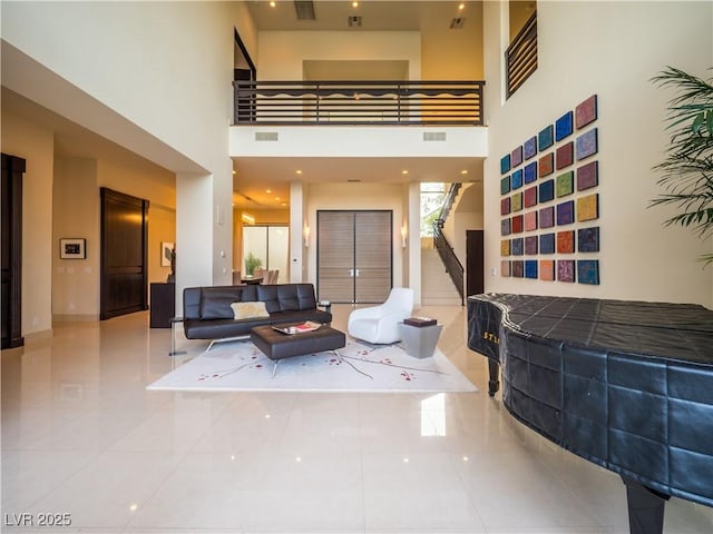 building lobby featuring stairway and visible vents