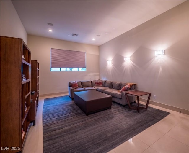 living area with light tile patterned floors, visible vents, baseboards, and recessed lighting