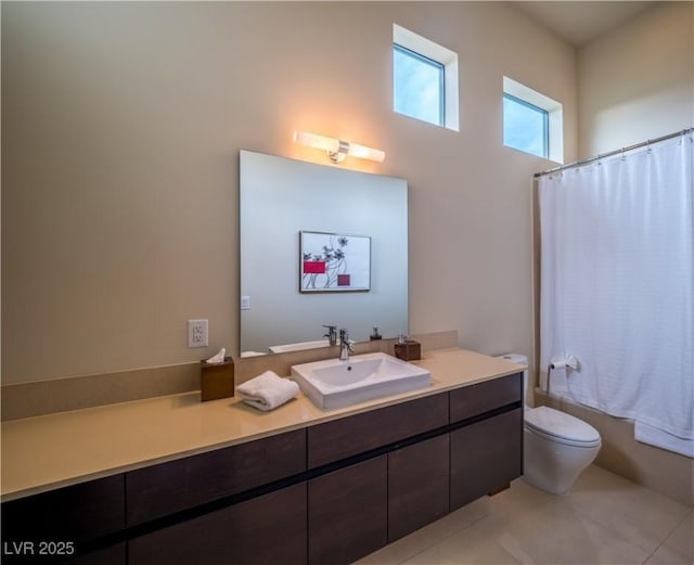 full bath featuring toilet, tile patterned floors, shower / bath combination with curtain, and vanity