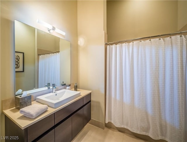 full bath featuring tile patterned flooring and vanity