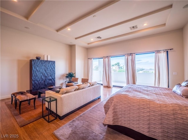 bedroom with visible vents, beamed ceiling, wood finished floors, access to exterior, and recessed lighting