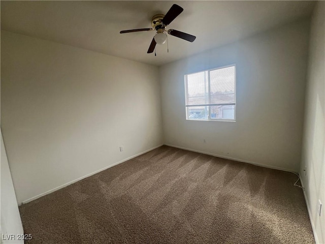 unfurnished room featuring a ceiling fan, carpet flooring, and baseboards