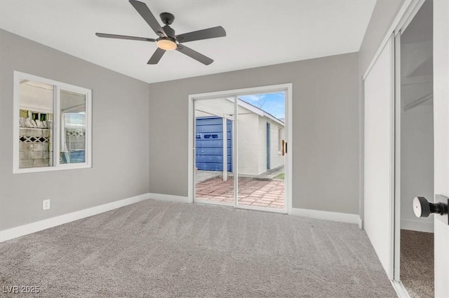 unfurnished bedroom with carpet floors, a closet, ceiling fan, access to outside, and baseboards