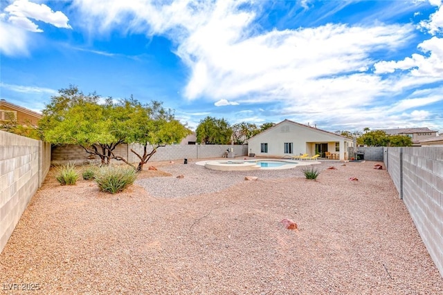 view of yard featuring a fenced backyard, an outdoor hot tub, a fenced in pool, and a patio