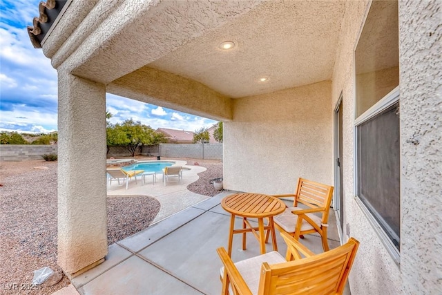 view of patio / terrace with a fenced in pool and a fenced backyard