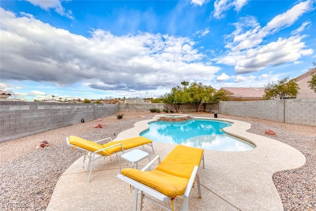 view of pool with a pool with connected hot tub, a fenced backyard, and a patio