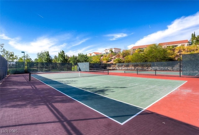 view of sport court with fence