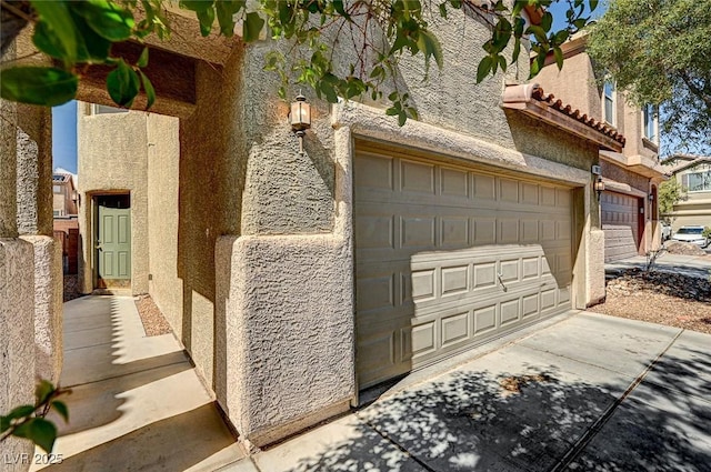 garage featuring driveway