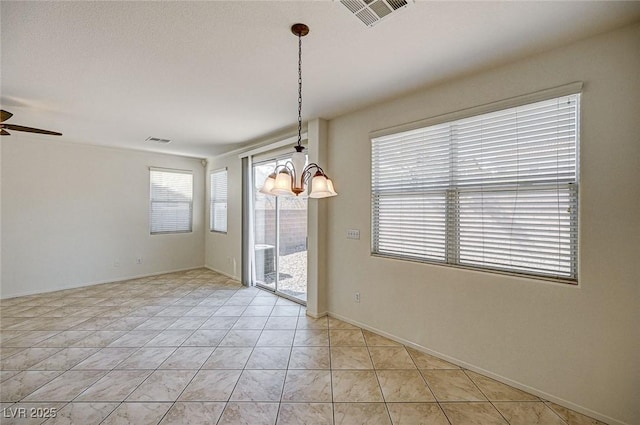 unfurnished room with ceiling fan with notable chandelier, light tile patterned flooring, visible vents, and baseboards