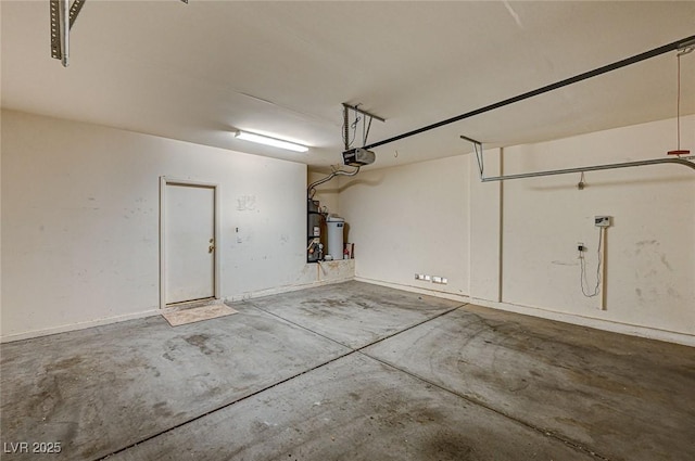 garage featuring a garage door opener and water heater