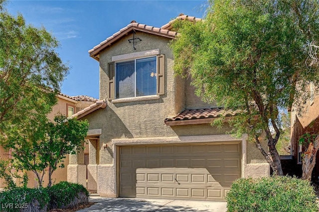 view of front of property with a garage, a tile roof, driveway, and stucco siding