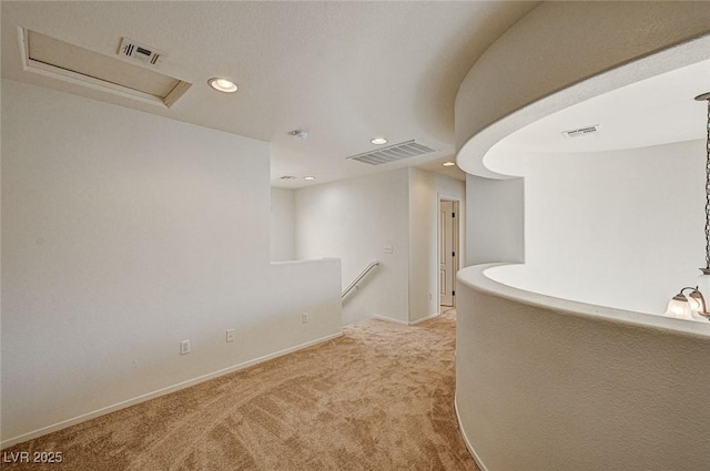 corridor featuring visible vents, carpet, an upstairs landing, and recessed lighting