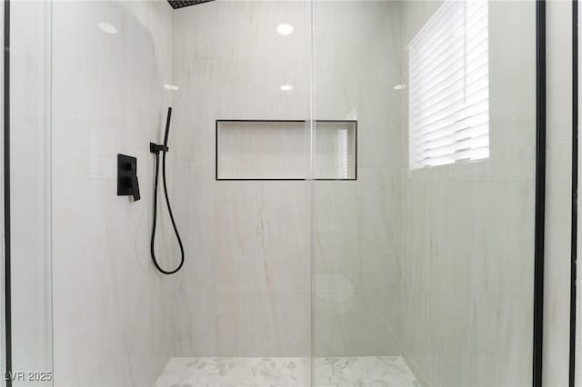 full bath with a marble finish shower