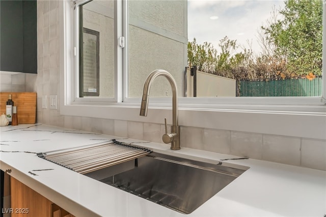 room details with a sink and decorative backsplash