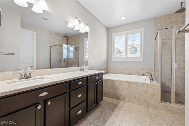 full bath with a garden tub, a stall shower, a sink, and visible vents