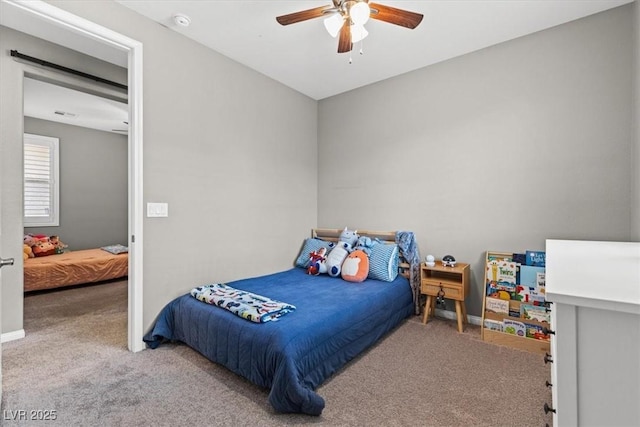 bedroom with carpet floors, baseboards, and a ceiling fan