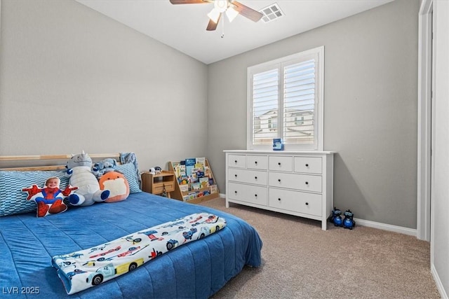 carpeted bedroom featuring visible vents, baseboards, and ceiling fan