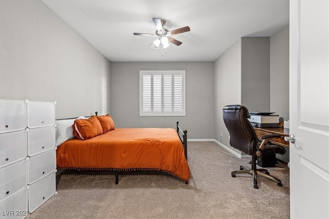 carpeted bedroom featuring ceiling fan and baseboards