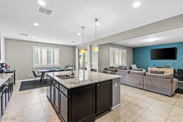 kitchen with a healthy amount of sunlight, visible vents, and a sink