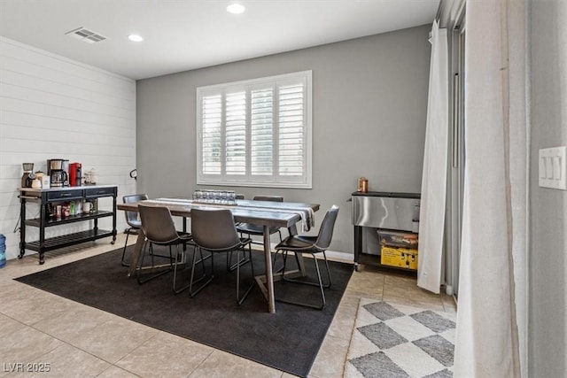 tiled dining room featuring recessed lighting and visible vents