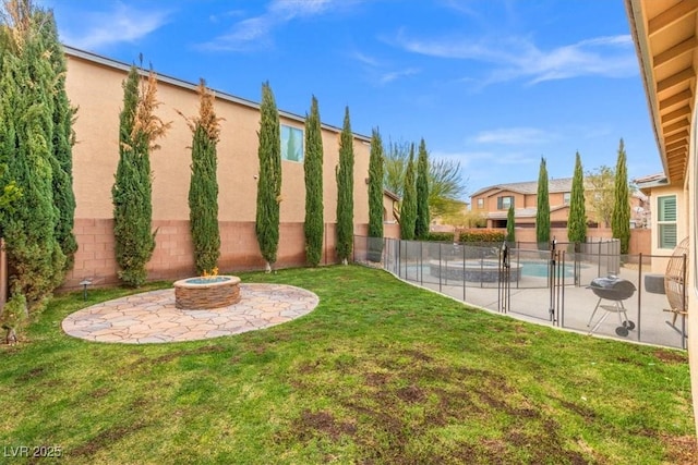 view of yard featuring an outdoor fire pit, a patio area, and a fenced backyard