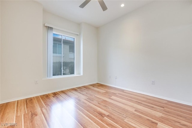 unfurnished room with light wood-type flooring, ceiling fan, baseboards, and recessed lighting