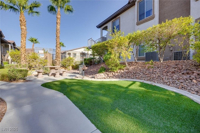 view of yard with fence and a patio