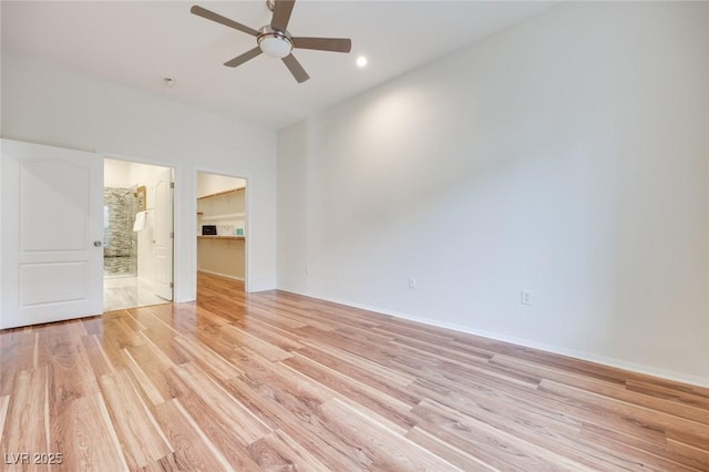 unfurnished bedroom with ceiling fan, light wood-style flooring, recessed lighting, a spacious closet, and a closet