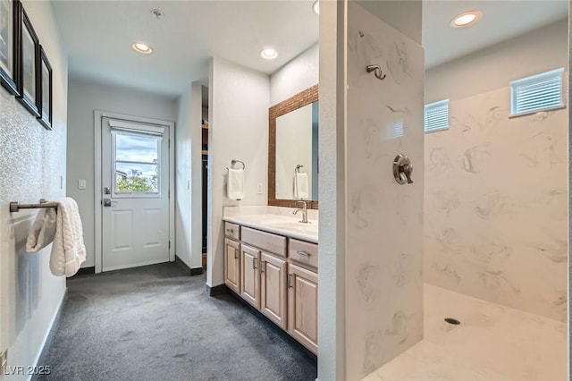 full bathroom featuring recessed lighting, visible vents, a shower, and vanity