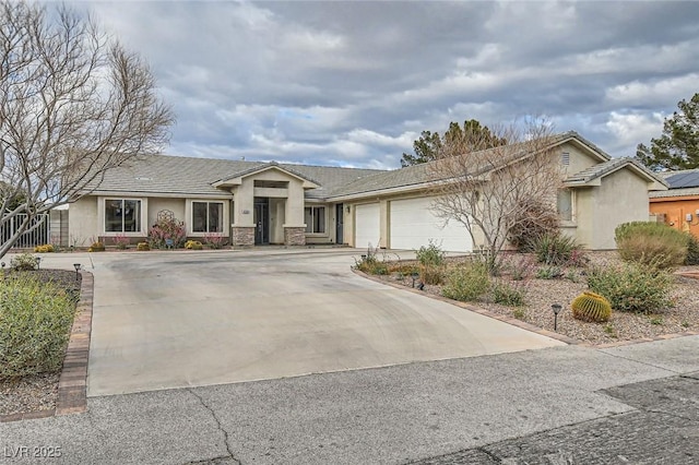 ranch-style home featuring a garage, driveway, and stucco siding